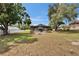 A large backyard features a fire pit and a covered screened pool at 2219 Summit View Dr, Valrico, FL 33596