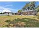 Spacious backyard featuring a screened pool area and sprawling green lawn at 2219 Summit View Dr, Valrico, FL 33596