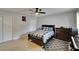 A well-lit bedroom featuring a ceiling fan, tile flooring, a bed, and a dresser at 2219 Summit View Dr, Valrico, FL 33596