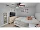 Bedroom featuring a ceiling fan, light colored walls, and ample room at 2219 Summit View Dr, Valrico, FL 33596