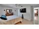 The bedroom offers tile floors, ceiling fan, closet, and mounted flat screen television at 2219 Summit View Dr, Valrico, FL 33596