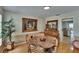 Cozy dining area featuring a marble-topped table, ornate furniture, wood floors and a plant at 2219 Summit View Dr, Valrico, FL 33596