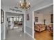 Elegant foyer with shiny tile floors, chandelier, and a view of the living room at 2219 Summit View Dr, Valrico, FL 33596