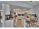 Bright kitchen with a breakfast bar, marble countertops, and white cabinetry at 2219 Summit View Dr, Valrico, FL 33596