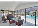 Enclosed lanai with outdoor dining set, perfect for entertaining near the pool at 2219 Summit View Dr, Valrico, FL 33596