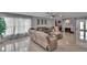 Spacious living room featuring a large sectional sofa, fireplace, decor, and access to other areas of the home at 2219 Summit View Dr, Valrico, FL 33596