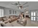 Cozy living room featuring a fireplace, sectional sofa, and stylish decor, perfect for relaxation and entertainment at 2219 Summit View Dr, Valrico, FL 33596