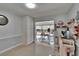 Mud room featuring tile flooring, built-in shelving and views to the exterior at 2219 Summit View Dr, Valrico, FL 33596