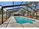 Spacious backyard pool area featuring a screened enclosure for year-round enjoyment at 2219 Summit View Dr, Valrico, FL 33596