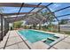A backyard pool is surrounded by a screened enclosure providing a private escape at 2219 Summit View Dr, Valrico, FL 33596