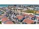 Beautiful view of the condos and community with palm trees, a pool, and walking distance to the beach at 230 Medallion Blvd # G, Madeira Beach, FL 33708