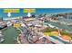 Community aerial view shows proximity to beach, Winn Dixie, library, and new condos, highlighting convenient location at 230 Medallion Blvd # G, Madeira Beach, FL 33708