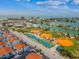 Community aerial view showing proximity to tennis, baseball, and ocean, highlighting recreation and amenities at 230 Medallion Blvd # G, Madeira Beach, FL 33708