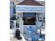 Entrance to Madeira Beach Yacht Club Condos with an anchor decor and gate at 230 Medallion Blvd # G, Madeira Beach, FL 33708
