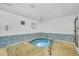 Enjoy the community hot tub with tiled surround, providing a relaxing and luxurious amenity at 230 Medallion Blvd # G, Madeira Beach, FL 33708