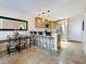 Cozy kitchen with granite countertops, stainless steel appliances, open access to dinette area at 230 Medallion Blvd # G, Madeira Beach, FL 33708