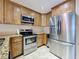 Modern kitchen features stainless steel appliances, granite countertops and beautiful cabinetry at 230 Medallion Blvd # G, Madeira Beach, FL 33708