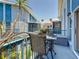 Patio featuring outdoor dining set overlooking common grounds and a palm tree at 230 Medallion Blvd # G, Madeira Beach, FL 33708
