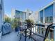 Patio with outdoor seating set, tropical plants and neighborhood views at 230 Medallion Blvd # G, Madeira Beach, FL 33708