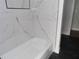 Modern bathroom featuring stylish marble-look tiling in the shower/tub and a dark floor at 2699 Seville Blvd # 802, Clearwater, FL 33764