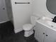 Stylish bathroom featuring a modern vanity, toilet, dark floors, and updated fixtures for comfort at 2699 Seville Blvd # 802, Clearwater, FL 33764
