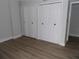 Clean bedroom offers spacious closets and new flooring, creating a serene and functional space at 2699 Seville Blvd # 802, Clearwater, FL 33764