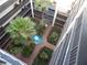 Overhead view of courtyard featuring fountain, palm trees, and walkways at 2699 Seville Blvd # 802, Clearwater, FL 33764