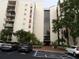 Modern building featuring prominent balconies, covered parking, and convenient access to handicap parking at 2699 Seville Blvd # 802, Clearwater, FL 33764