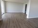 Spacious living room with new wood floors and slider doors at 2699 Seville Blvd # 802, Clearwater, FL 33764