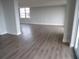 Bright, open living room features new floors, fresh walls, and natural light, creating a modern feel at 2699 Seville Blvd # 802, Clearwater, FL 33764
