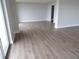 Spacious living room showcasing modern flooring and neutral walls, ready for personalization and comfort at 2699 Seville Blvd # 802, Clearwater, FL 33764