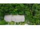 Aerial view showcasing the landscaping, parking area, and green space at 2913 Fig Ct, Palm Harbor, FL 34684