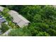 Aerial view showcasing the landscaping, parking area, and green space at 2913 Fig Ct, Palm Harbor, FL 34684