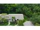Aerial view showcasing the landscaping and setting at 2913 Fig Ct, Palm Harbor, FL 34684