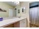 Spacious bathroom with large vanity, storage cabinets, and a shower at 2913 Fig Ct, Palm Harbor, FL 34684