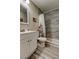 Updated bathroom features a stylish tiled shower, modern vanity, and neutral walls at 2913 Fig Ct, Palm Harbor, FL 34684