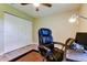Neutral office space includes closet, desk, and ceiling fan, all in a clean organized design at 2913 Fig Ct, Palm Harbor, FL 34684