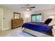 Comfortable bedroom featuring natural light from balcony windows and closet at 2913 Fig Ct, Palm Harbor, FL 34684