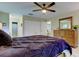 Bedroom features ceiling fan, wood-look floors, and closet at 2913 Fig Ct, Palm Harbor, FL 34684