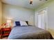 Bright bedroom featuring a cozy bed, side table, and a closet at 2913 Fig Ct, Palm Harbor, FL 34684