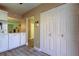 Open kitchen looking into living area with pantry closet at 2913 Fig Ct, Palm Harbor, FL 34684
