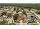 Aerial view of a residential neighborhood with lush greenery and several houses at 29713 Bright Ray Pl, Wesley Chapel, FL 33543