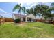 View of the backyard with a hammock, and fresh lawn at 29713 Bright Ray Pl, Wesley Chapel, FL 33543