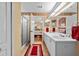 Bathroom with dual sinks, granite countertops, shower and an open view into the bedroom at 29713 Bright Ray Pl, Wesley Chapel, FL 33543
