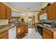 Spacious kitchen with granite countertops, tile flooring, and stainless steel appliances at 29713 Bright Ray Pl, Wesley Chapel, FL 33543