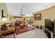 Open-concept living area showcasing tile floors, comfortable furniture, and a seamless transition to the dining space at 29713 Bright Ray Pl, Wesley Chapel, FL 33543