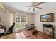 Home office features a window for natural light and wood laminate flooring at 29713 Bright Ray Pl, Wesley Chapel, FL 33543