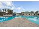 Resort-style community pool with a spacious deck and plenty of room for residents to relax and enjoy the Florida sunshine at 29713 Bright Ray Pl, Wesley Chapel, FL 33543
