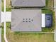 Aerial view of the home's roof, backyard, screened patio, and proximity to neighboring houses at 32231 Conchshell Sail St, Wesley Chapel, FL 33545