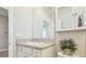 White bathroom vanity with granite countertop and modern sink basin at 32231 Conchshell Sail St, Wesley Chapel, FL 33545